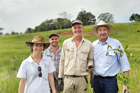 Team pictured standing on koala habitat farmland