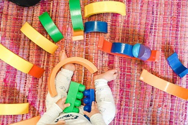 Baby playing with blocks