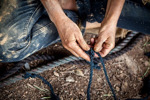 Picture of hands weaving twine and rope