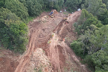 Aerial view of road works and machinery.