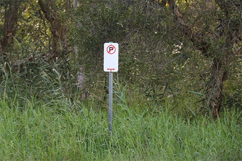 No-parking-sign-on-the-side-of-the-road.jpg