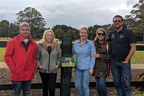 Photos of three volunteers and two staff