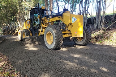 grader on gravel road