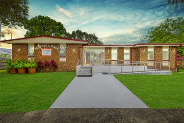 exterior of brick building with new path and concrete ramp
