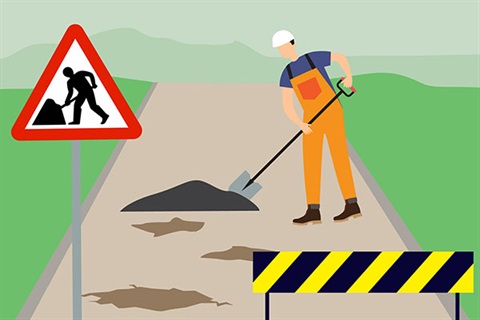 cartoon image with road work sign and barrier in foreground with person shovelling dirt on road in background