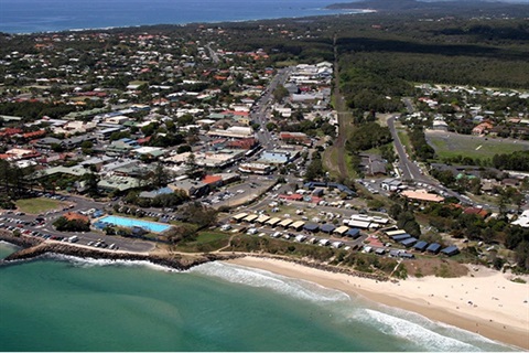 Photo of Byron Bay township including beach and bypass route behind main street