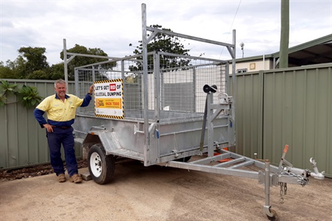 Ken standing next to the trailer for hire from the tip